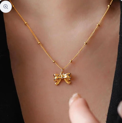 Pretty Gorgeous Stuff coquette bow pendant necklace close-up