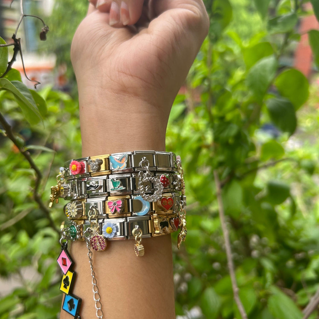 Pretty Gorgeous Stuff mixed Italian charm bracelet with plain and hanging charms close-up