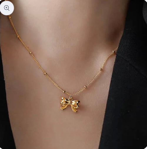 Pretty Gorgeous Stuff coquette bow pendant necklace product shot