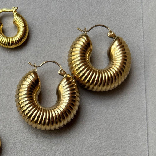 Pretty Gorgeous Stuff gold rope textured hoop earring close-up