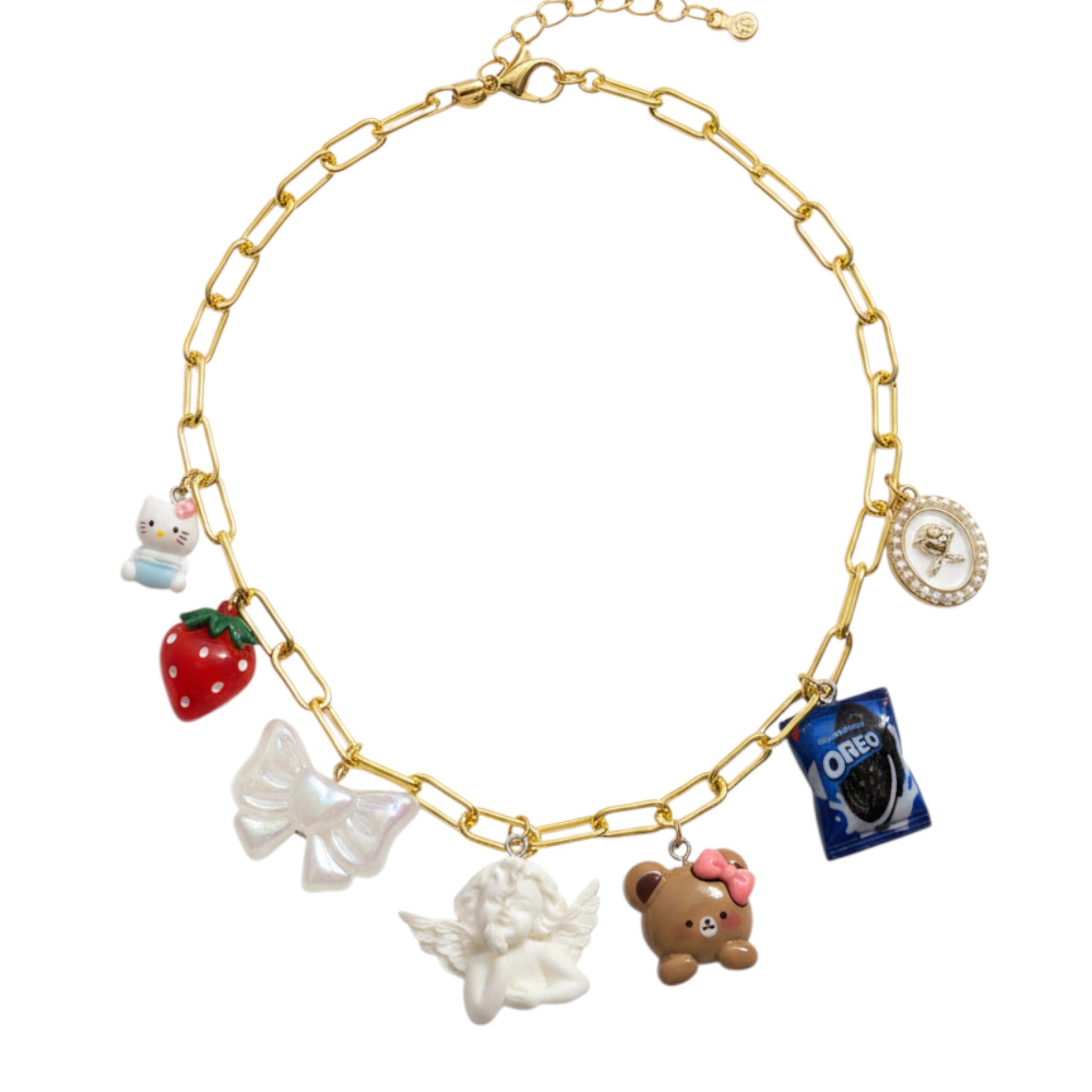 Pretty Gorgeous Stuff gold chain necklace featuring an angel, teddy bear, strawberry, and cookie charms.