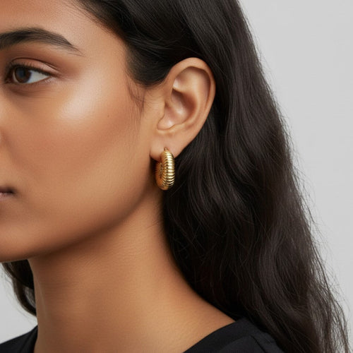 Pretty Gorgeous Stuff gold-plated alloy rope textured hoop earring worn by a model