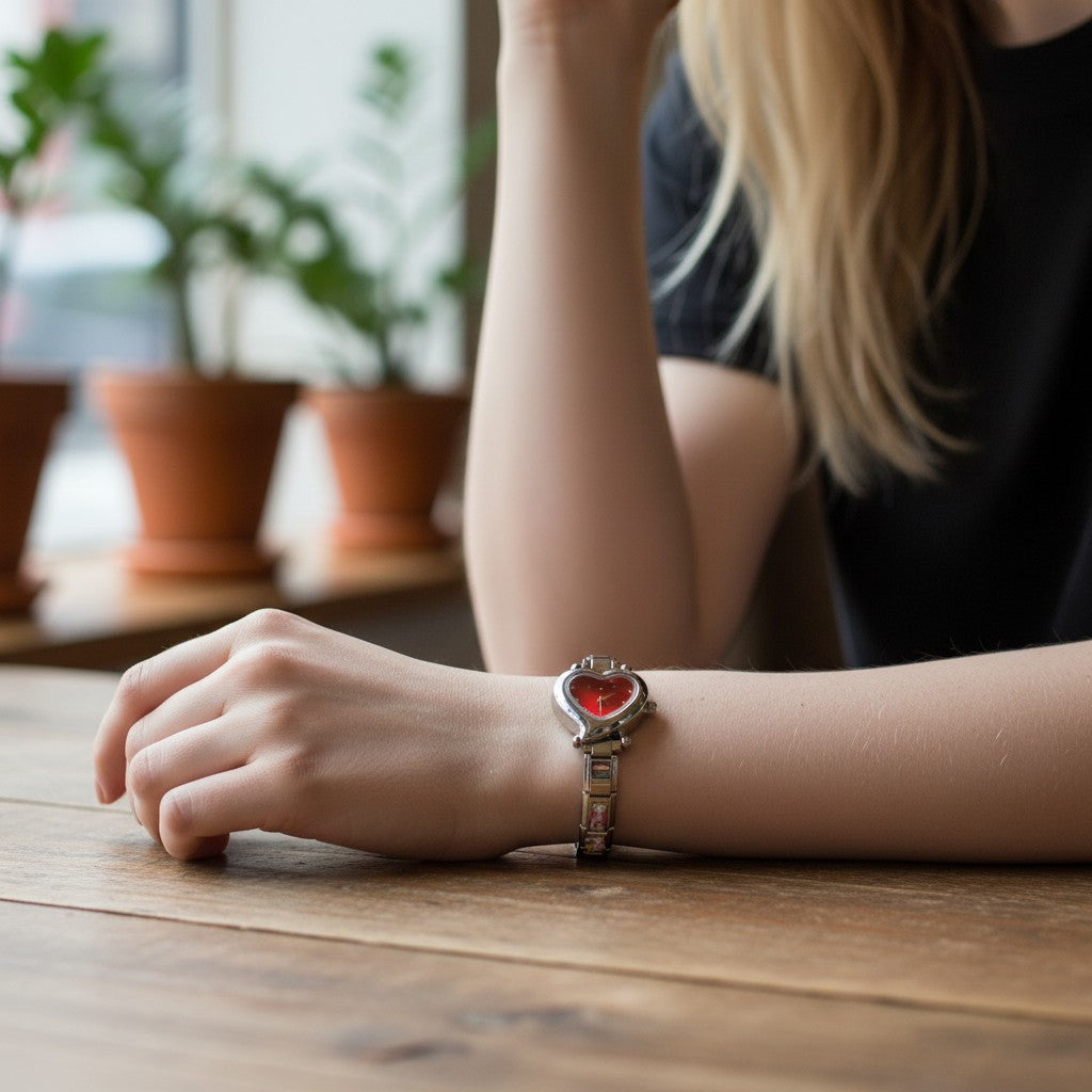 Pretty Gorgeous Stuff silver Italian charm watch with a red heart-shaped dial worn on a woman's wrist